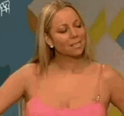 Mariah Carey Fixing Hair In Interview GIF
