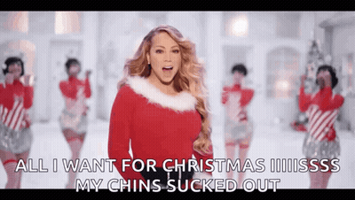 Mariah Carey In Santa Claus Sweater Singing Christmas Song GIF