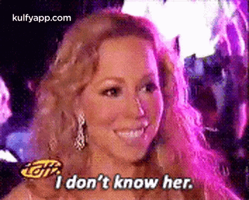Mariah Carey Is Smiling And Saying `` I Don 'T Know Her . '' GIF