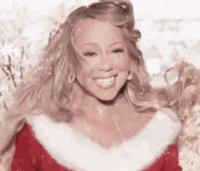 Mariah Carey Is Wearing A Santa Suit And Smiling . GIF