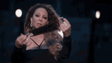 Mariah Carey Wearing Black Face Mask GIF