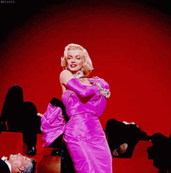 Marilyn Monroe Wink In A Pretty Pink Dress GIF