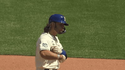 Mariners Baseball Player In Blue Helmet And White Jersey GIF