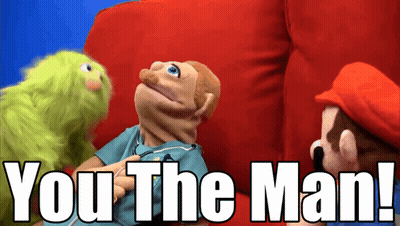 Mario And A Green Puppet Are Sitting On A Red Couch With The Words " You The Man " Below Them GIF