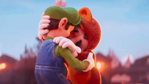 Mario And Luigi Are Hugging Each Other In A Cartoon . GIF