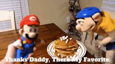 Mario And Slinky Puppet Next To Pancakes With Marshmallows GIF
