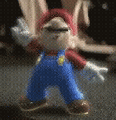 Mario Figure Standing On Table GIF