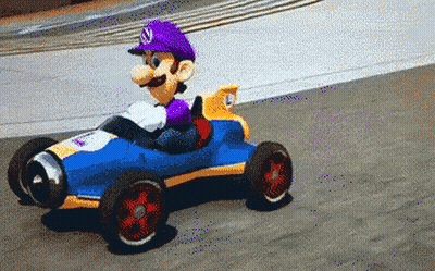 Mario In Purple Hat Driving Blue And Yellow Toy Car GIF