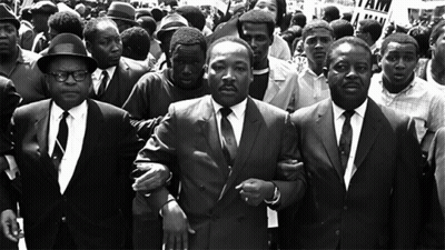 Martin Luther King Jr. Escorted By Men In Suits GIF