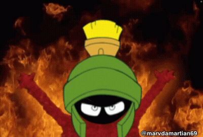 Marvin The Martian Is Standing In Front Of A Fire GIF