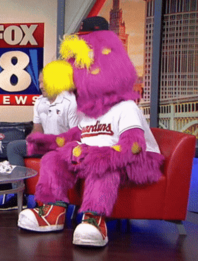 Mascot For The Indians Sitting On Red Chair GIF