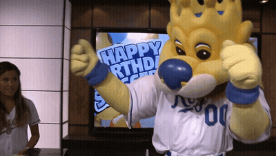 Mascot Giving Thumbs Up In Front Of TV Saying Happy Birthday GIF