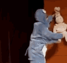 Mascot Guy Punching Toy GIF