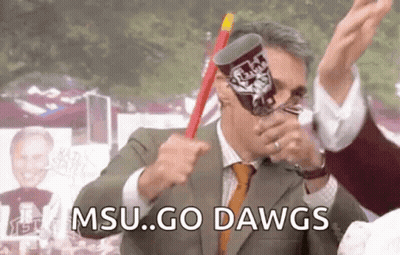 Mascot Holding Flag Saying Dags Min GIF
