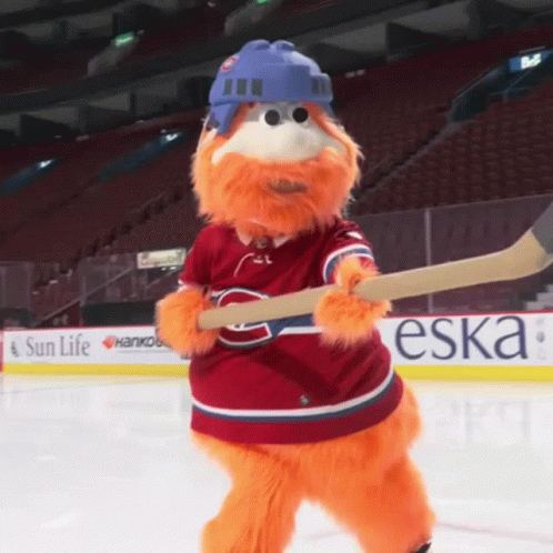 Mascot Holding Hockey Stick In Front Of Sun Life Ad GIF