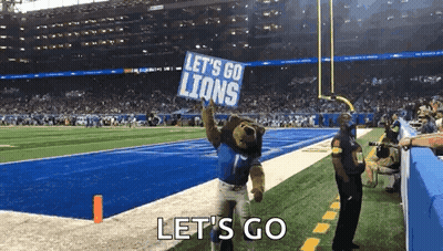 Mascot Holding Let's Go Lions Sign GIF