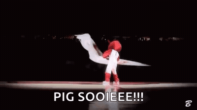 Mascot Holding Red And White Flag On Basketball Court GIF