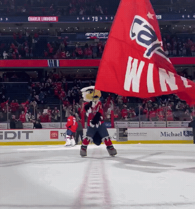 Mascot Holding Red Flag Saying Cap Win GIF