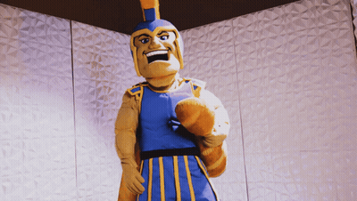 Mascot In Blue And Yellow Outfit And Helmet GIF