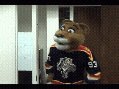 Mascot In Jersey Number 93 Standing In Doorway GIF