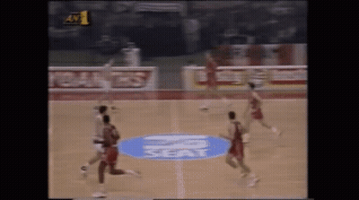 Mascot In Number 0 Jersey Standing In Front Of Crowd GIF