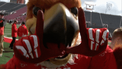 Mascot In Red And White Gloves Saying Pan 12 GIF