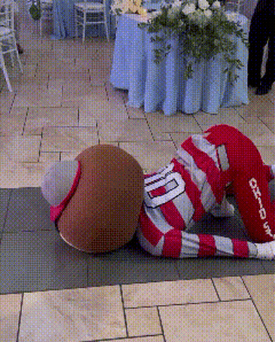 Mascot In Red And White Striped Outfit With Number 10 GIF