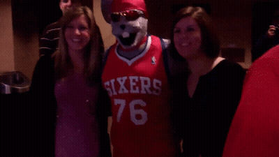 Mascot In Sixers Jersey Posing With Women GIF