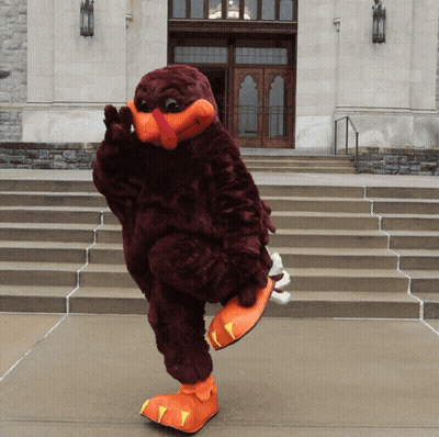 Mascot In Turkey Costume Standing On One Leg GIF