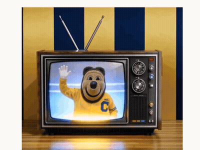 Mascot In Yellow Shirt With Letter C On TV GIF