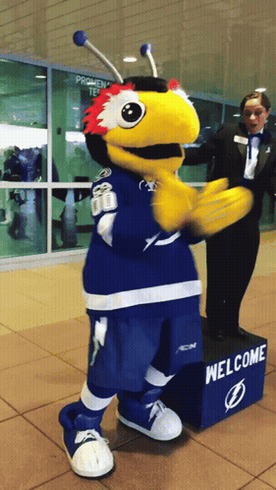 Mascot Next To Welcome Sign GIF