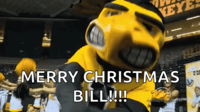 Mascot Saying Merry Christmas Bill With Cheerleaders GIF