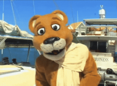 Mascot Standing In Front Of Boat Saying Progress GIF