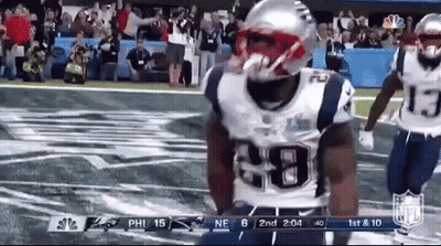Mascot Standing In Front Of Land Banner GIF