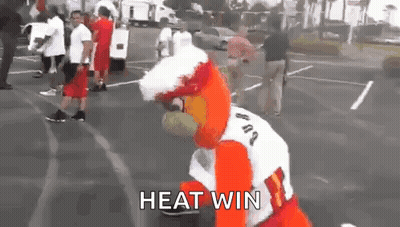 Mascot Standing In Parking Lot Saying Heat Win GIF