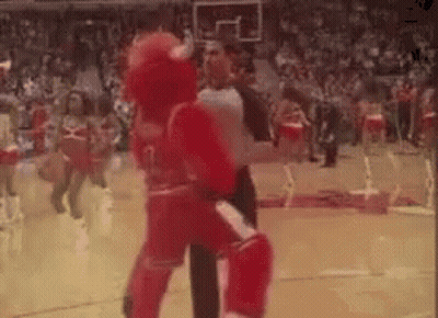 Mascot Standing On Basketball Court With Referee GIF