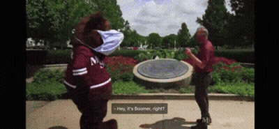 Mascot Wearing Mask Talks To Man In Park GIF