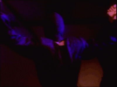 Masked Man Beside Another Man GIF