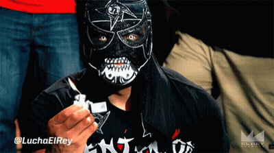Masked Man Holding Lighter @Luchaelrey GIF