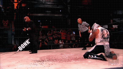 Masked Man Holding Lighter @Luchaelrey GIF