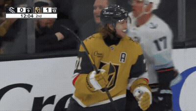 Masked Man Holding Microphone On Stage GIF