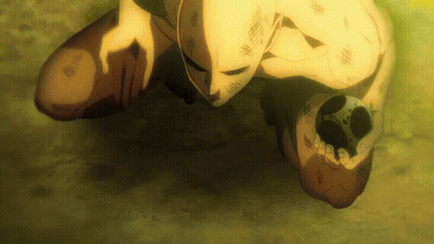 Masked Man Kneeling Holding Something GIF
