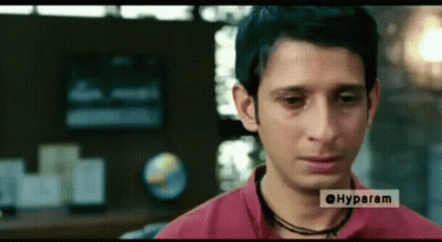 Masked Man Talking To Another Man Tu Sei Pieno Fino Qua Oggi GIF