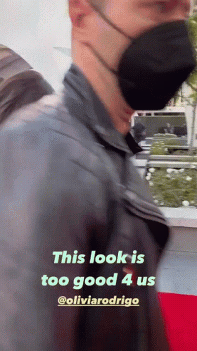 Masked Man Walking On Red Carpet GIF