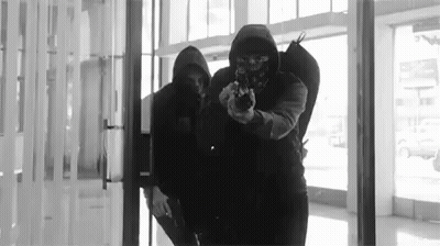 Masked Men Holding Guns GIF