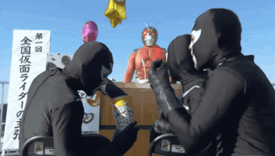 Masked People Gathered In Front Of 第 1 回 Sign GIF