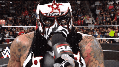 Masked Wrestler Holding Microphone Saying Raw GIF