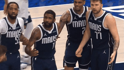 Mavericks Basketball Players Standing On Court GIF