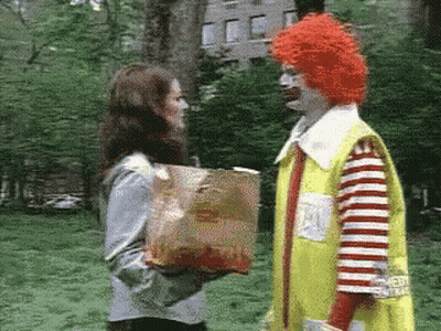 McDonald's Clown Giving Woman Bag of French Fries