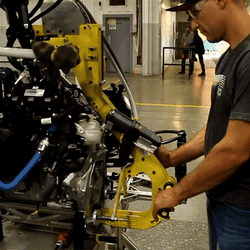 Men Assembling A Snowmobile GIF